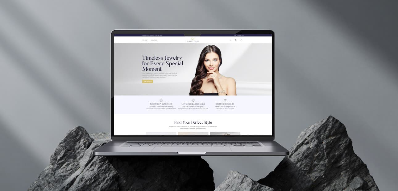 Maria's Touch website on a laptop